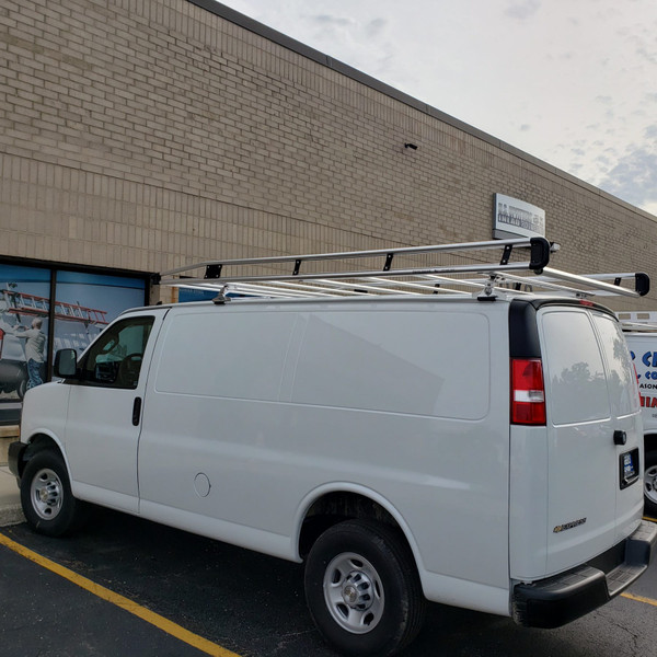 Prime Design AluRack AR1303-S installed on a full-size GM van for storage and transportation solutions.