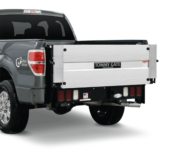 Tommy Gate G2 Series Hydraulic Platform lift on gray full-size pickup truck.