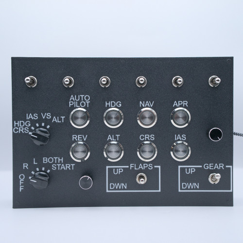 Aviation autopilot control panel with a black textured surface, various labeled dials and switches for navigation and flight control, including 'AUTO PILOT', 'HDG', 'NAV', 'APR', and toggle switches labeled 'FLAPS' and 'GEAR' with 'UP' and 'DWN' indicators