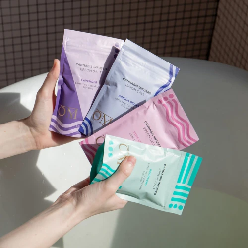 The full flight of Om Wellness Epsom Salts with CBD and Delta 9 includes four varieties, Recovery, Arnica Relief, Lavender, and Rose Geranium.