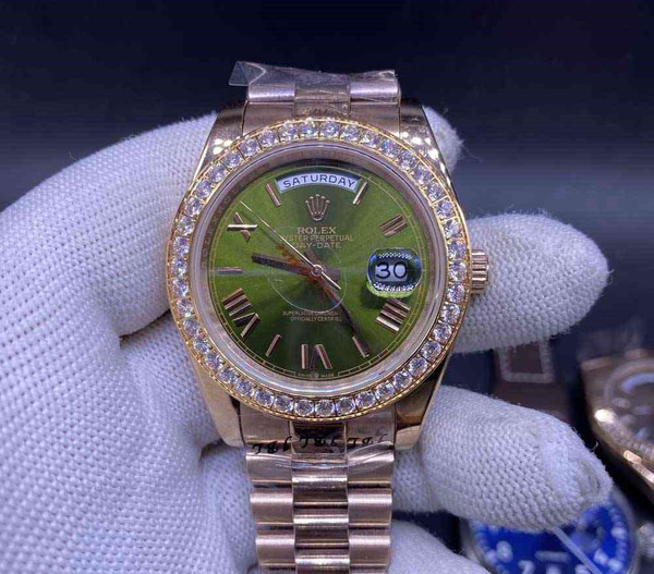 Buy High quality replica Iced Out Rolex DayDate rose gold case 40mm, green dial roman numbers from the best trusted, fake clone swiss designer brand watch website