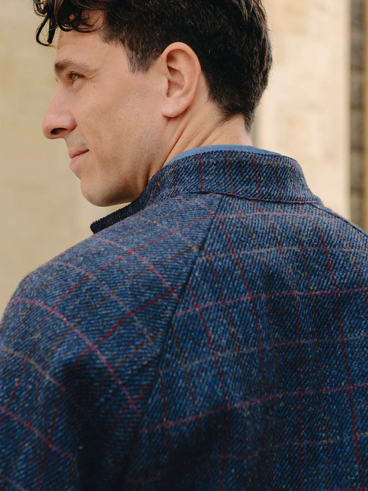 Model wears Navy Harris Tweed® Harrington Jacket Back Detail