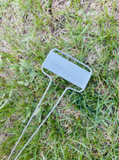 C-Series zinc garden marker with classic angled face plate and galvanized steel legs – ideal for labeling vegetables, herbs, and flowers in garden beds, pots, or raised planters. Weatherproof, rust-resistant, and reusable metal plant tag made in the USA for lasting outdoor use.