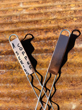 A-Series copper garden marker featuring a solid copper nameplate and galvanized wire legs – ideal for labeling herbs, vegetables, and flowers with a touch of elegance. Naturally weather-resistant and patinas beautifully over time. Durable, reusable, and proudly made in the USA.
