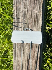 Close-up of E-Series Zinc Garden Marker with durable galvanized steel wire legs and weather-resistant zinc nameplate – ideal for outdoor plant labeling in vegetable gardens, herb beds, flower plots, and botanical displays. Rustproof and reusable metal garden marker proudly made in the USA.
