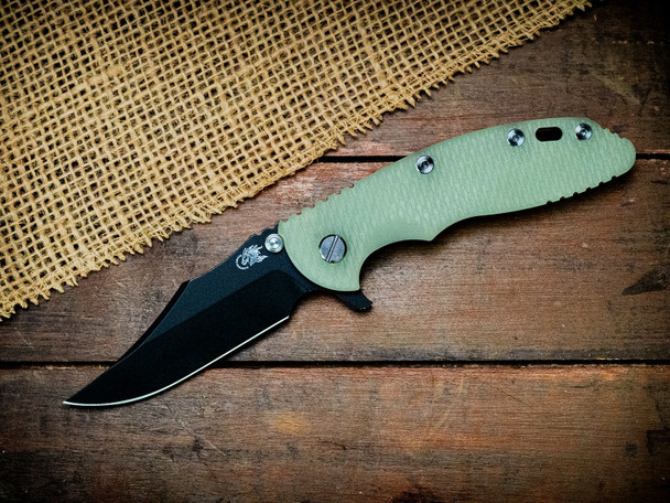 HINDERER KNIVES XM-18 3.5" MAGNACUT BOWIE TRI-WAY BATTLE BLACK TRANSLUCENT GREEN G10 HINDERER KNIVES XM-18 3.5" MAGNACUT BOWIE TRI-WAY BATTLE BLACK TRANSLUCENT GREEN G10