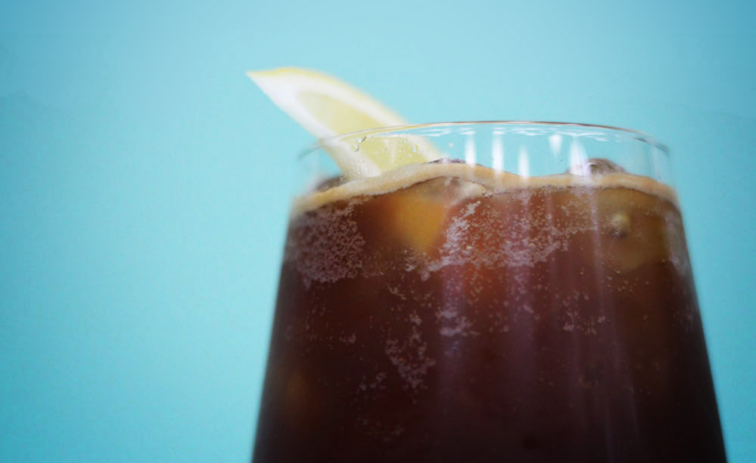 Extract Coffee Roasters - Iced Coffee Cold Brew with Lemon Garnish  Extract Coffee Roasters - Iced Coffee Cold Brew with Lemon Garnish