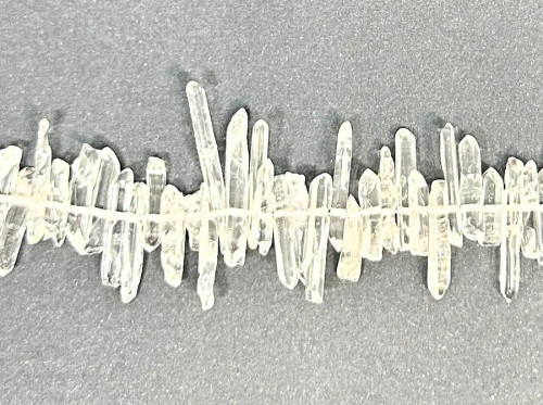Natural Crystal Quartz Points, most are 13-16mm long, 4" strand