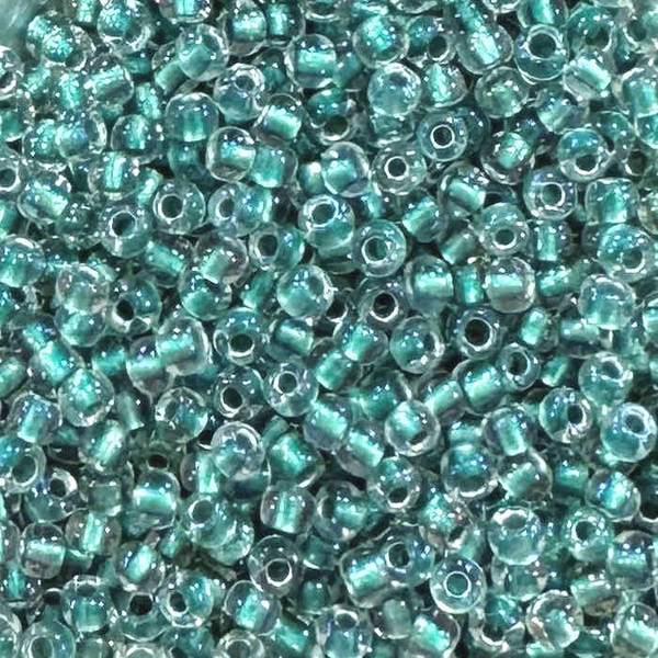 8-0264, Teal-Lined Crystal (28 gr.) Toho (Discontinued)