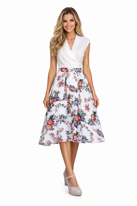 Model wearing a white V-neck mock two-piece midi dress with a fitted waist and multicoloured floral pleated skirt
