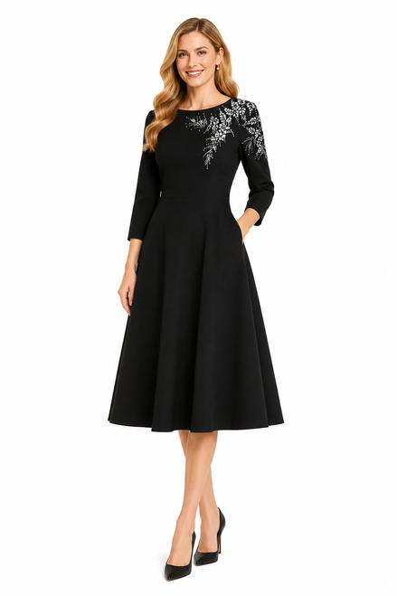 Model wearing a black fit-and-flare midi dress with elbow-length sleeves and silver fern shoulder embellishment