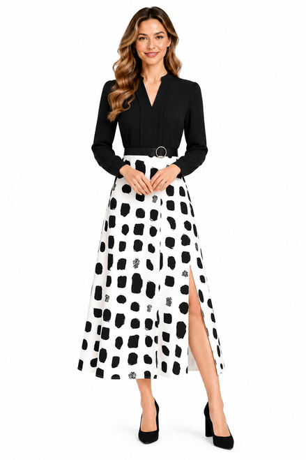 Model wearing a black V-neck long-sleeve blouse with a belted black-and-white midi skirt featuring a side slit