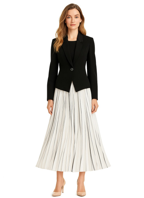 Model wearing a fitted black blazer with a black and white pleated maxi skirt