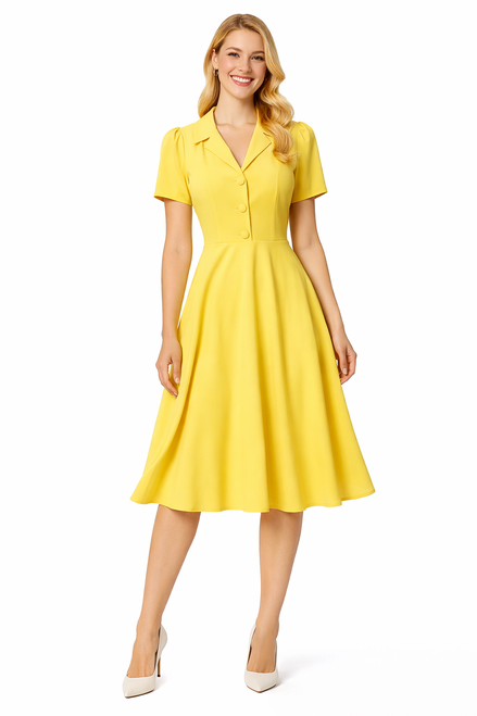 Model wearing a primrose yellow knee-length tea dress with short puff sleeves, covered front buttons, a gathered waist and pleated skirt