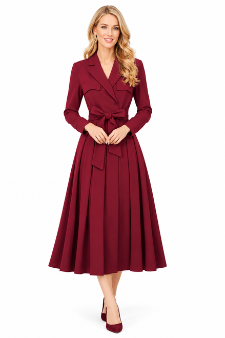 Model wearing a burgundy long-sleeve trench dress with a waist tie and pleated midi skirt