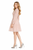 Model wearing a beige embroidered eyelet knee-length dress with a stand collar, long sleeves and tiered flared skirt
