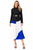 Model wearing a fitted black jacket with a blue, white and black pleated midi skirt