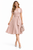 Model wearing a nude puff-sleeve fit-and-flare dress with a self-tie belt