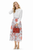 Model wearing a white pintuck blouse and floral pleated midi skirt set