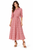 Model wearing a red multicoloured ikat-print button-front midi shirt dress with long sleeves and a self-tie belt