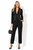 Model wearing a black contrast-stitched cropped blazer with matching high-waisted cigarette trousers