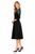 Model wearing a black fit-and-flare midi dress with elbow-length sleeves and silver fern shoulder embellishment