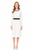 Model wearing a white long-sleeve sheath dress with contrasting black trim