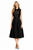 Model wearing a black sleeveless velvet top with lace inserts and a high-waisted pleated midi skirt