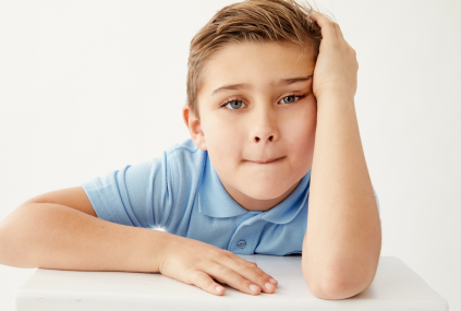 Boy stressed about choosing an outfit for school.