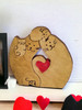 Wooden Cat Family Decoration with a Red Heart on the shelf