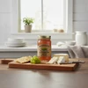 Scuppernong jelly is good with cheese and crackers, pictured on a cheese board with grapes.