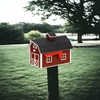 Burgundy and white Wooden Barn Mailbox on the post