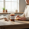 Caramel Pecan Apple Butter spread on toast with jar on a kitchen table