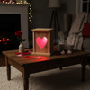 Red Heart  Rustic Wooden LED Lantern lit up on a romantic evening such as Valentine's day in a cozy home.