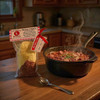 Red Beans and Rice hot and ready, just add sausage to make it a complete meal.  Setting is in a country kitchen.