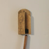 Step 1: Broom handle in position under the wall mounted holder ready to insert.