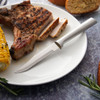 Easily slice through steak, pork chops, and chicken with a serrated knife by Rada.