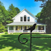 Metal Garden Flag Holder with Decorative Bird Emblem on top.