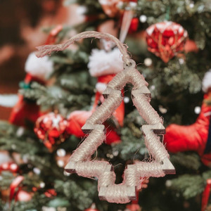 Twine Wrapped tree ornament makes a rustic Christmas tree look beautiful.