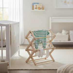 12-inch mini wooden floor standing baby clothes drying rack in nursery with crib and striped baby outfit