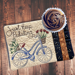 This motivational Mug Rug reminds you to "Just Keep Pedaling"  Handcrafted by a woman owned and operated small business for Harvest Array.