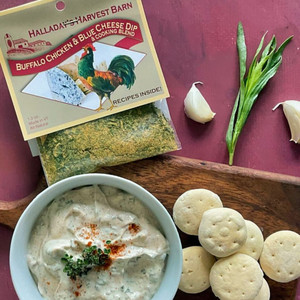 Buffalo Chicken & Blue Cheese Dip Mix packet and a bowl of the delicious dip with crackers.