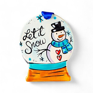 Cheerful snowman inside a hand-painted snow-globe ornament with frosty detailing and silver ribbon hanger