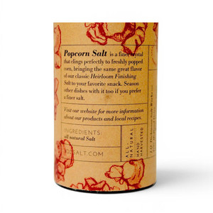 Back of the container of fine grain popcorn salt listing uses for the all natural hand harvested salt.
