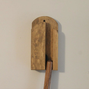 Step 4: Broom handle pushing the wooden ball  up into the broom holder a little more