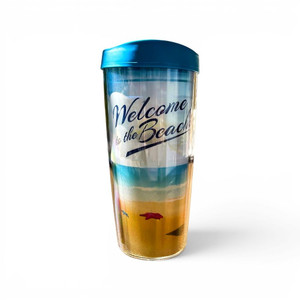 Welcome to the Beach 16 ounce Tumbler with a blue Lid. The design is of a yellow sandy beach with a red starfish, waves, and blue water. The words are written in the sky. Order now at harvestarray.com.