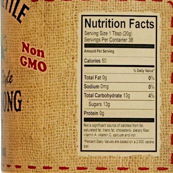 Non-GMO Scuppernong Jelly nutrition facts label showing calories, carbs, and sugar content.