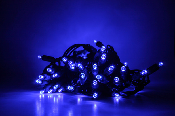 Outdoor LED Lighted Christmas Tree with Green Base and Purple Tree Lights