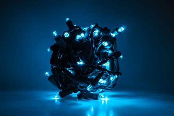 Outdoor LED Lighted Christmas Tree with Green Base and Green and Purple Tree Lights