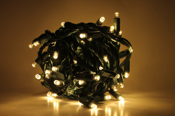 Outdoor LED Lighted Christmas Tree with Green Base and Green and Purple Tree Lights